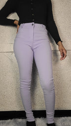 Person wearing light purple pants on a checkered floor